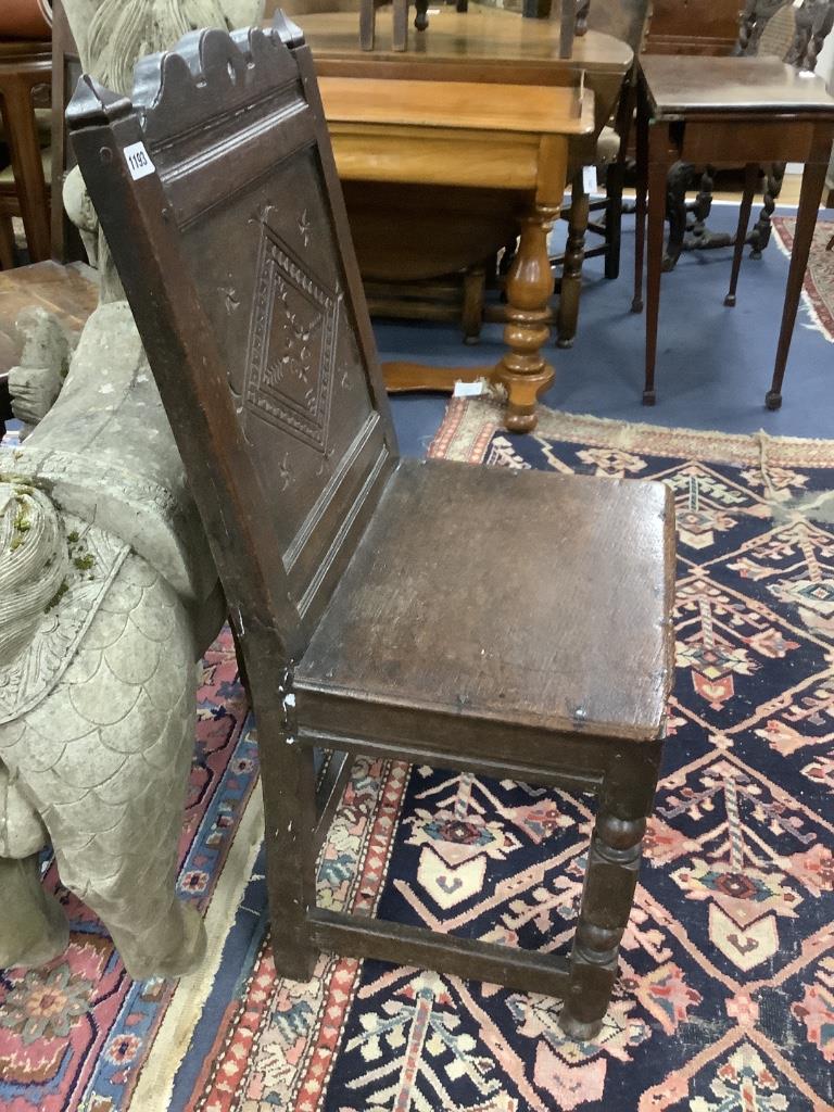 A 17th century oak back stool with lozenge carved decoration, width 48cm, depth 41cm, height 98cm